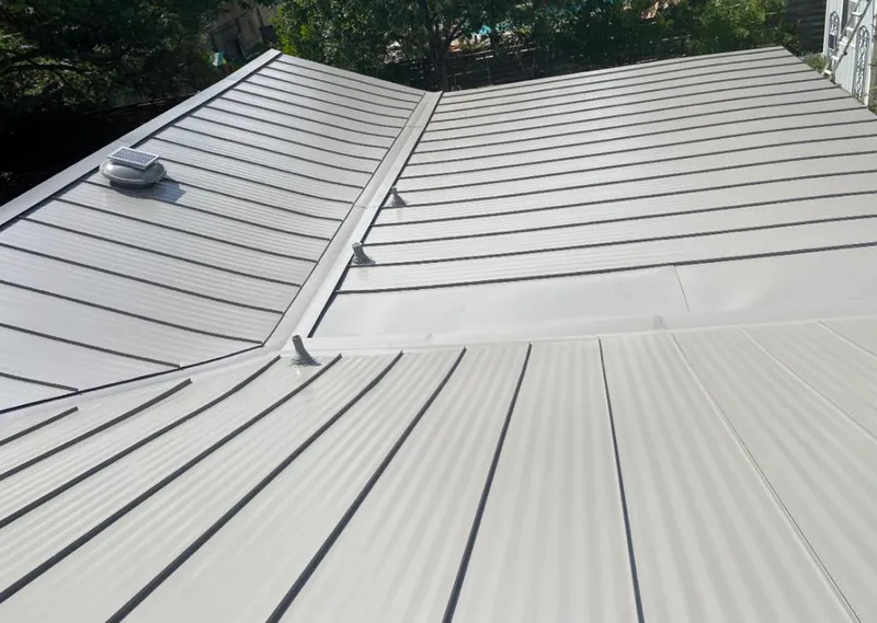 Solar attic fan installed on a metal roof for Roof Ventilation in Dry Run